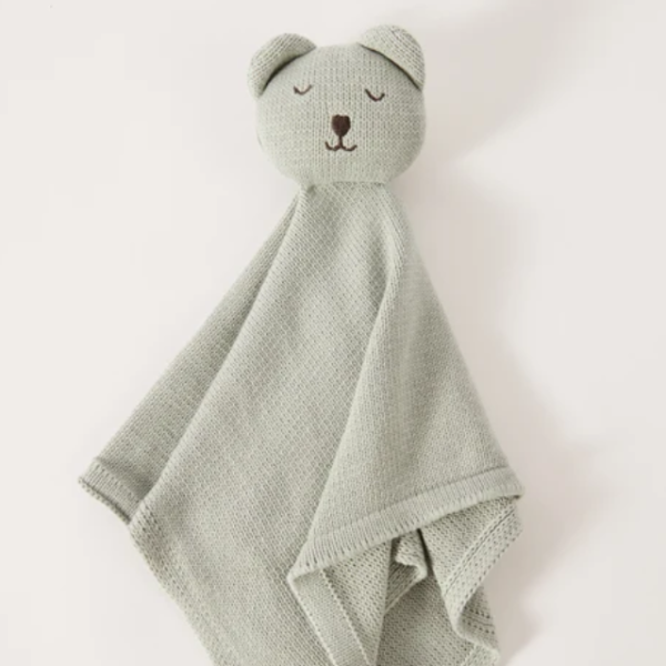 Soft and breathable organic cotton knit fabric with delicate scalloped edges.