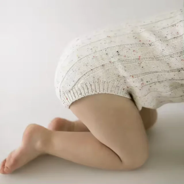 Soft, breathable, organic cotton fabric with a speckled ribbed texture for comfort.