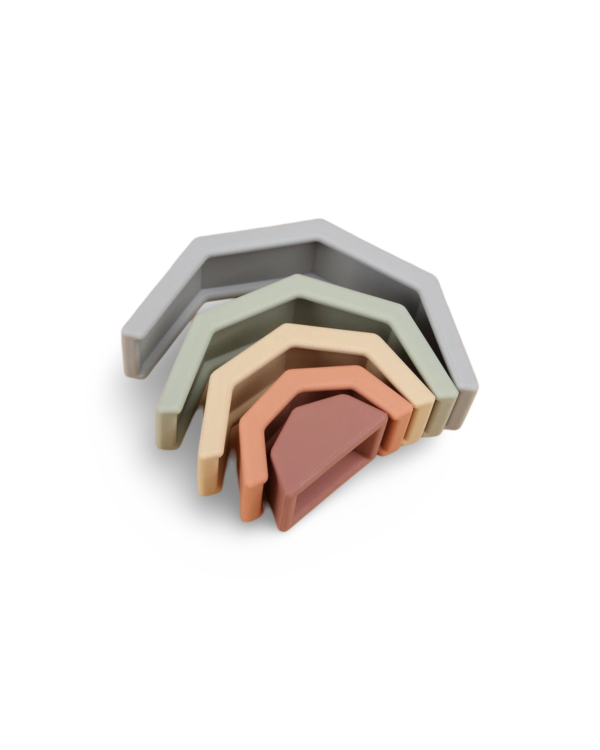 Close-up of the silicone rainbow, designed to stimulate fine motor skills and creativity in babies.