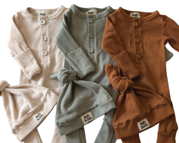 Close-up of soft 100% organic cotton onesie and beanie, ideal for keeping babies comfortable and warm.