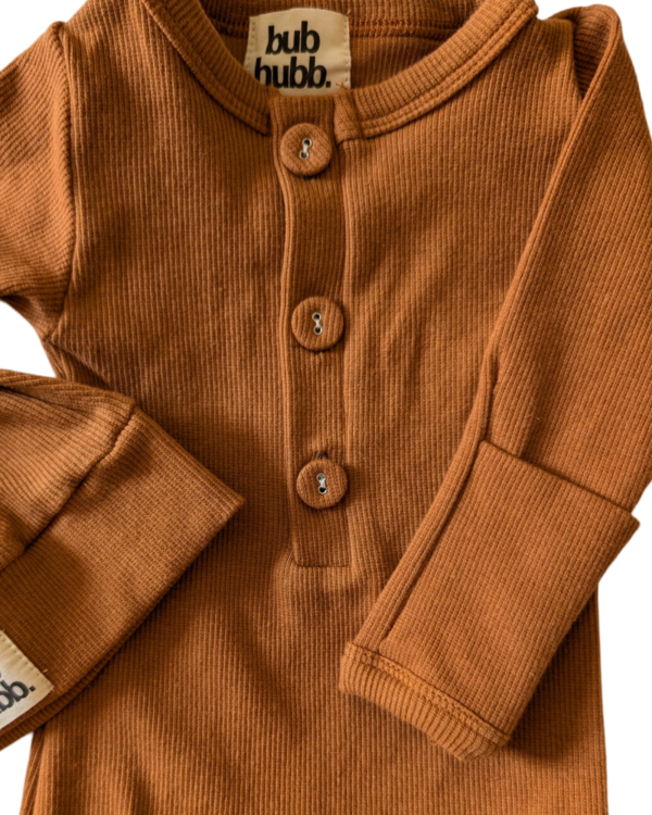 Organic cotton onesie and matching beanie available in different sizes for your growing baby.