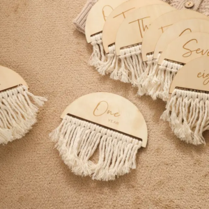 Boho milestone set with customizable baby name or message, made from natural wood and cloth.