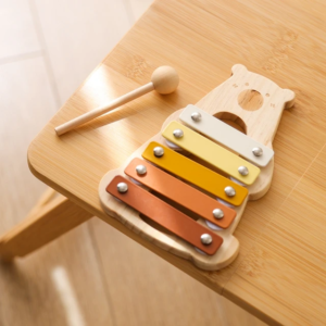 Eco-friendly wooden xylophone with colorful keys, designed for toddlers aged 2-4.