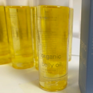 Organic belly oil with natural plant-based ingredients for tummy, scars, and skin care.