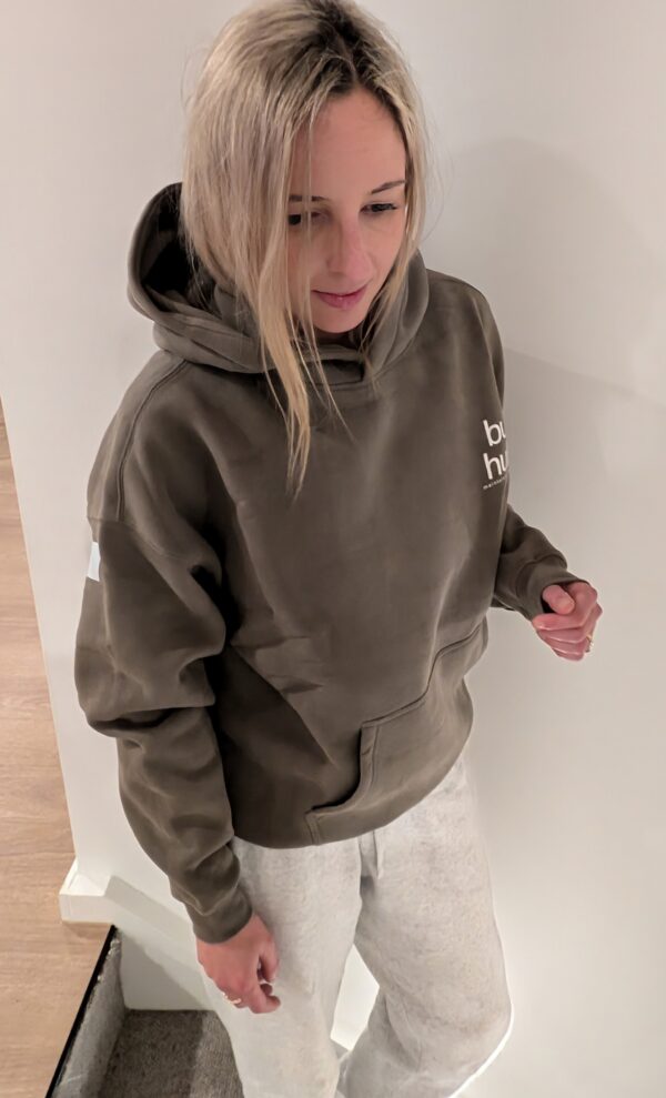 Soft, comfy hoodie displayed hanging on a rack, ready to be worn for a cozy, relaxed day.