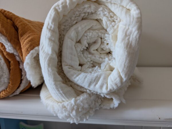 Soft and breathable 100% cotton muslin fabric paired with warm, cozy Sherpa lining.