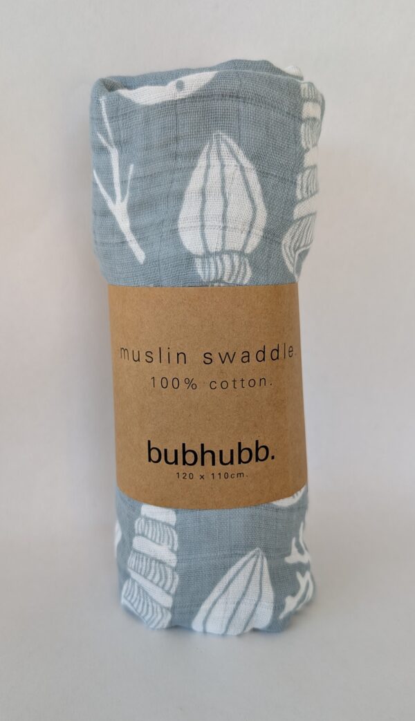 Cozy and breathable cotton muslin swaddle, keeping a newborn snug and comfortable.